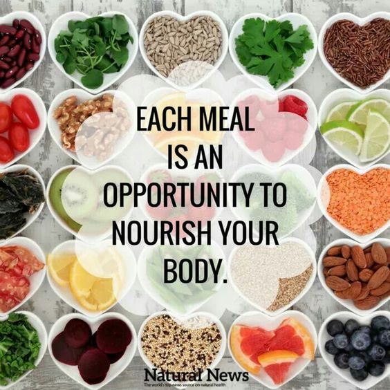 Health products start with food. Quote - Each meal is an opportunity to nourish your body overlay on heart-shaped bowls of healthy fruits, veggies, and nuts